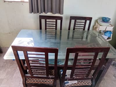 Wooden Dining table with 6 chairs for sale.