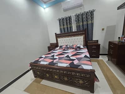 king size bed with deressing table and side table