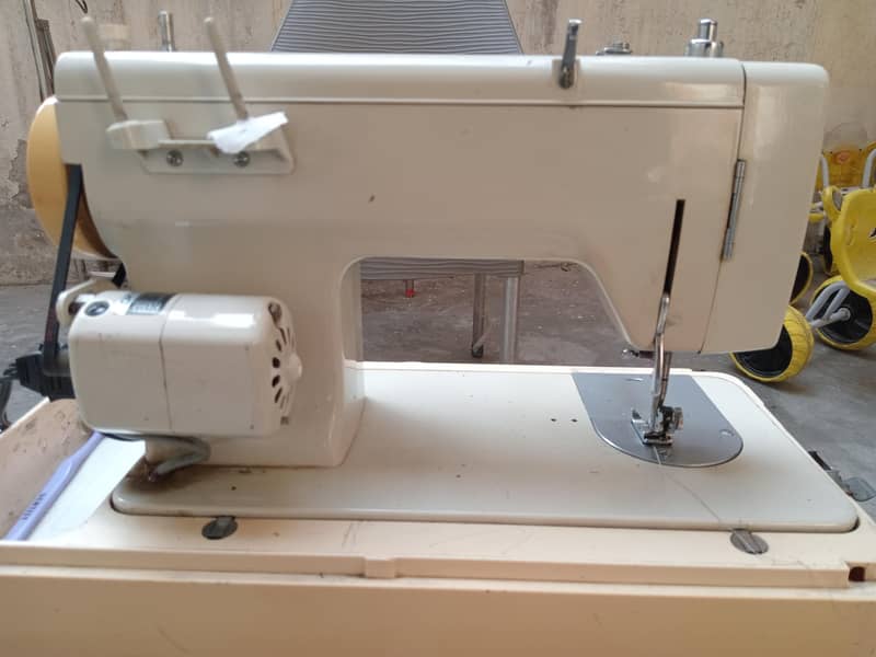sewing machine 11
