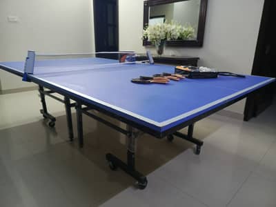 Foldable, wheels mounted table tennis with accessories