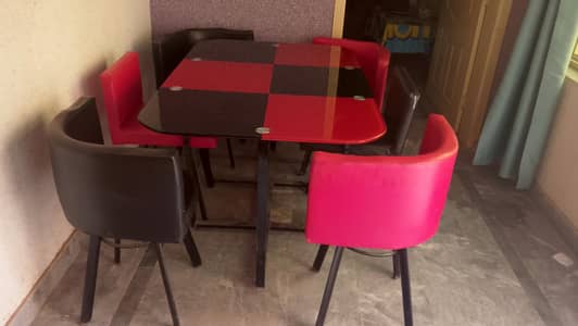 beautiful red and black glass dinning table