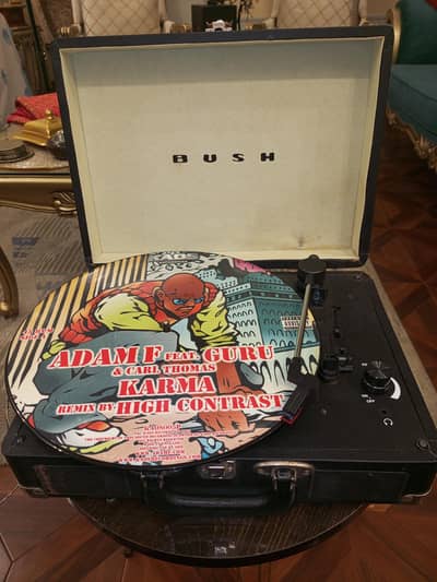 BUSH Company's 3 Speed Record Player. Built-in Speakers and Amplifier