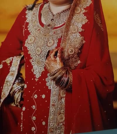 my full red bridal dress with matching jewelry.