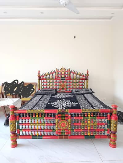 peera style bed and chairs with tables