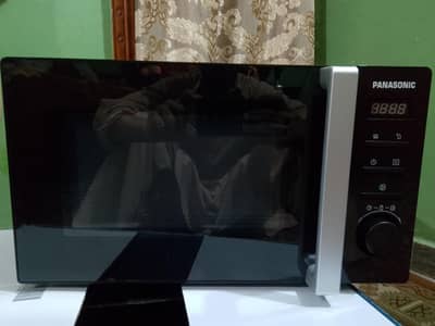Brand new microwave oven black  color 10by 10 condition  pack with box