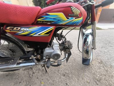 Red motor cycle CD 70 Honda 2021