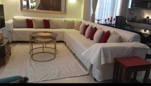 L Shaped off-white sofa