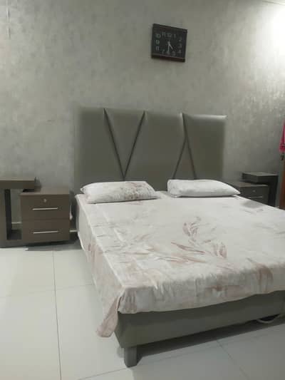 Leather Bed with side tables and dressing table