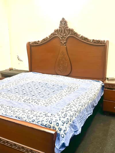 wooden bed and side tables