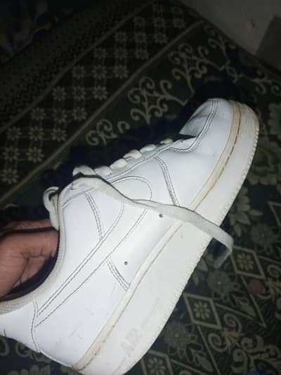 Nike Air Force 1 '07 low-top sneaker in white leather.