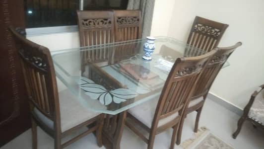 Elegant designed glass top dinning table for 6 persons