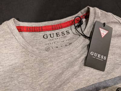 Original imported guess shirt for boy . Size is XS