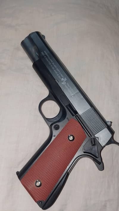 Plastic toy gun inside metal