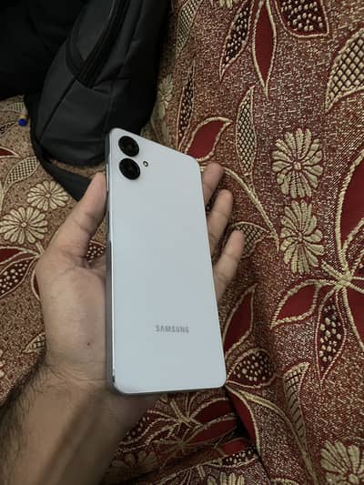 Samsung A06 ,with box and cable in warranty