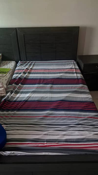 Single bed with side tables and dresser