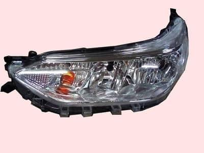 Toyota Yaris genuine headlights pair.