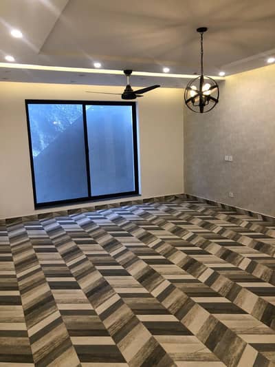 Beautifully Maintained 10-Marla Signature Style Bungalow with Basement & Lush Green Lawn Available for Rent in DHA Phase 7 A Modern-Day Mansion with Serene Surroundings