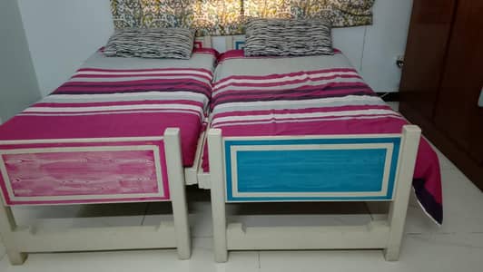 2 single wodden made bed