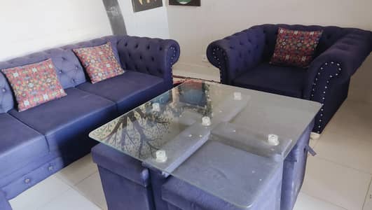 5 seater Chesterfield and Centertable with 4 stools