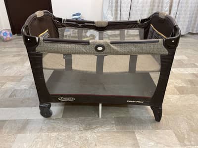 Baby cot with bedding