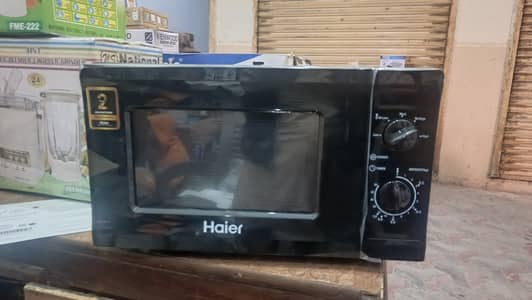 Haier 20L solo microwave oven with stylish black design