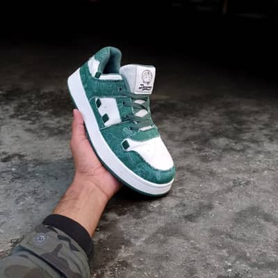 Green and white sneakers with patterned design