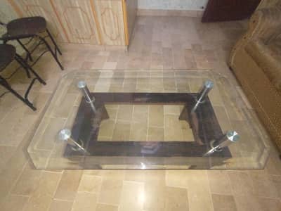 A DINING TABLE USED FOR SITTING AND SERVING FOOD ON THIS TABLE.