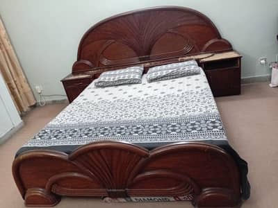 High quality wood bed along with side tables and dressing table.
