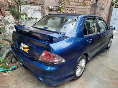 Mitsubishi Lanncer Car 1.3. Exchange b Hu sakti hai
