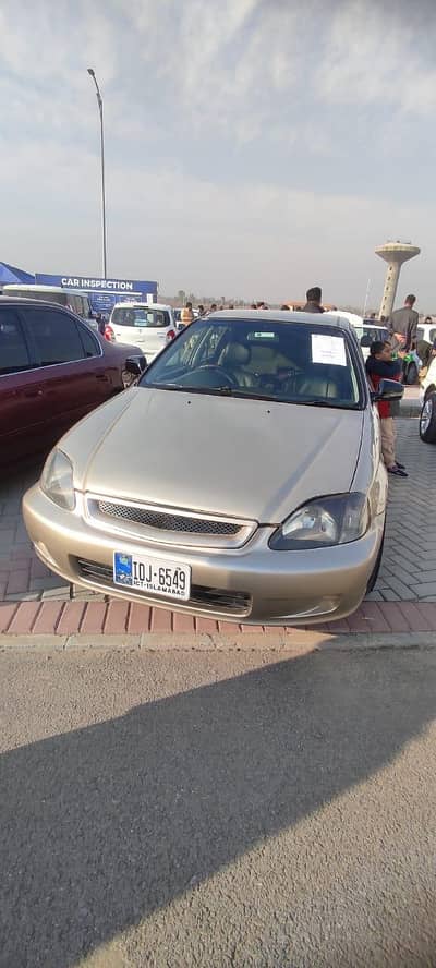 I'm selling my Gold Honda Exi 1999