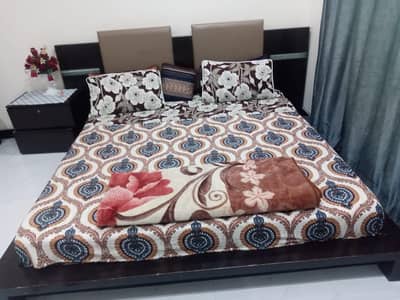 heavy wooden king size bed with two sides table