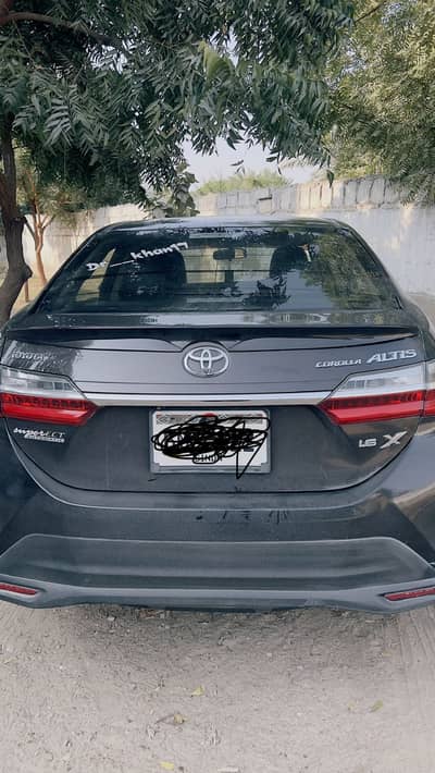 toyota altis 1.6 dark brown clr hain bikul ok hain koi kan nhi hai n