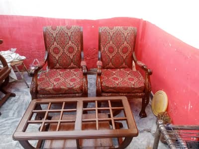 sofa wooden chairs with table.