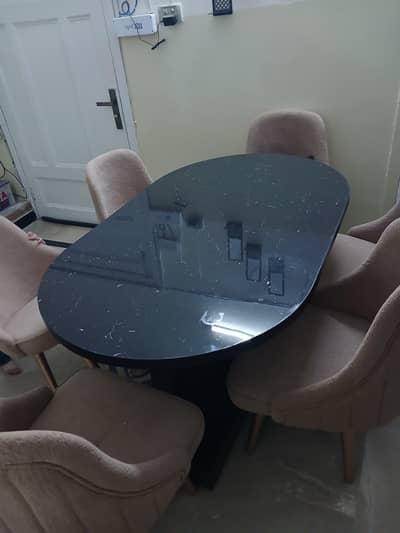 modern marble dining table with elegant chairs