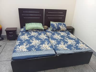 2 x single beds along with side tables