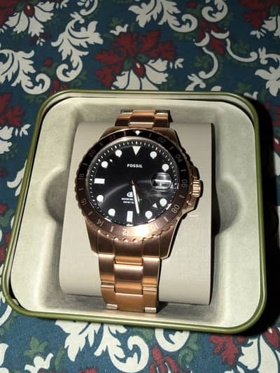 Fossil blue GMT rose gold-tone watch