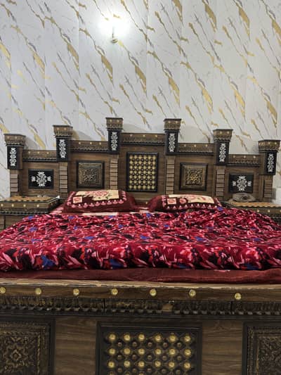 Wooden bed with side table and mirror