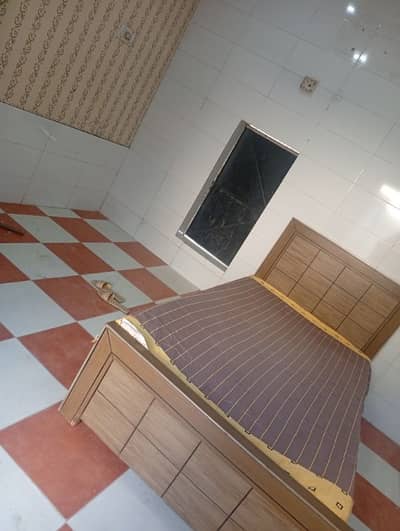 single wooden bed with side table