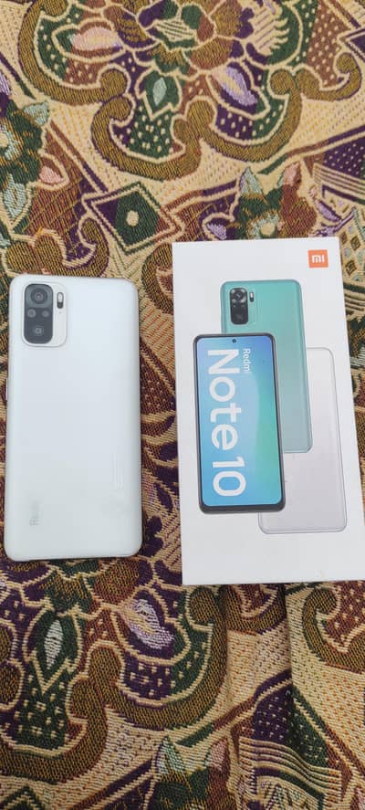 Redmi note 10. . . with box and original charger . . white colour