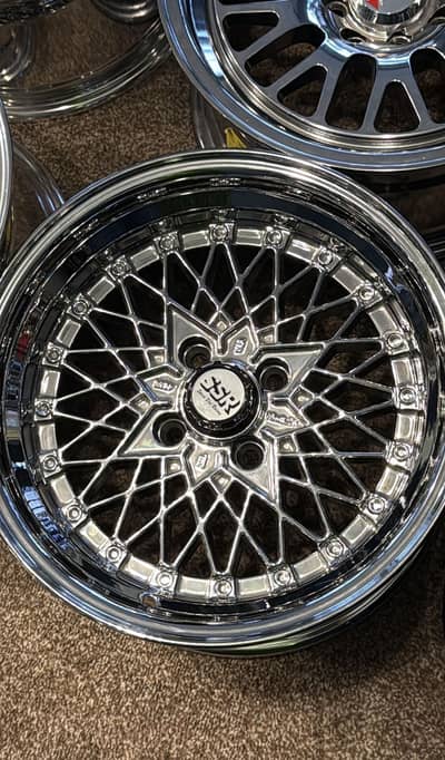 Chrome deep dish RIMS and low profile TYRES