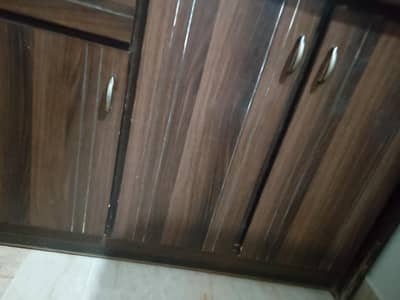 Table with attach scelf and cabinets , upper side iron rack