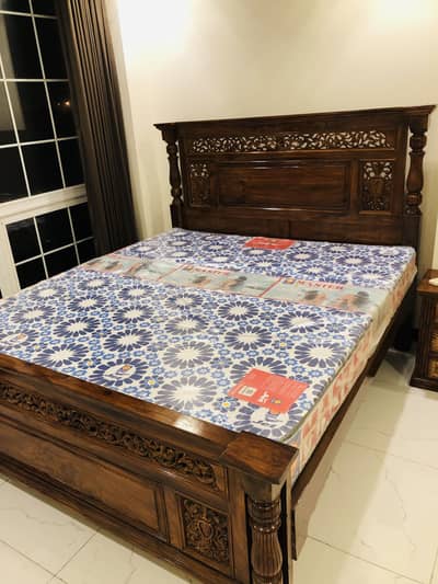 Wooden bed frame with mattress