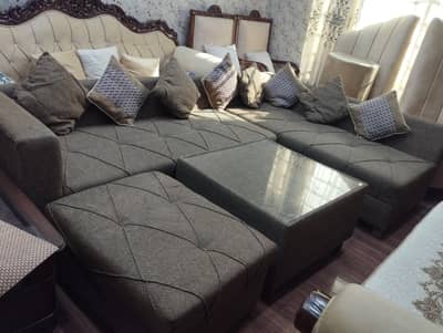 L shape sofa with center table and puffy