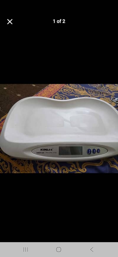 Kinlee weighing baby scale