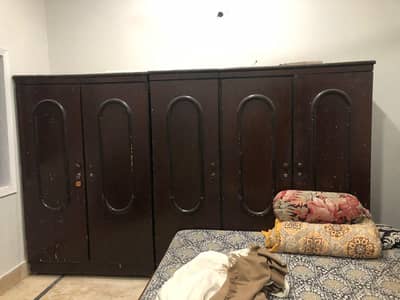 wooden bed and cupboard