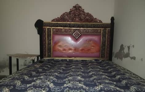 Durable Iron Bed with Ornate Headboard