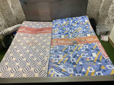 Two single materesses