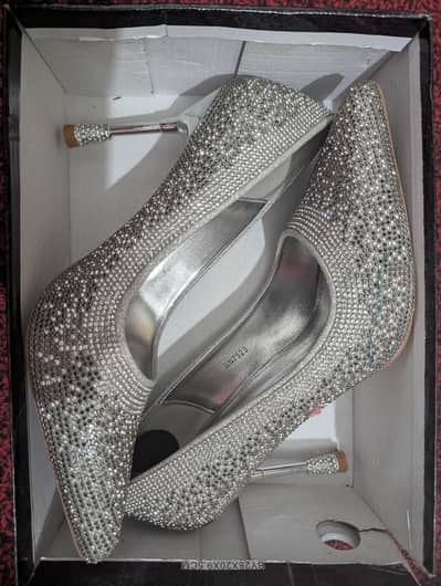 silver stiletto heels with embellishments