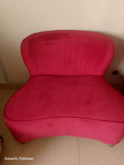 2 single red sofas  recently upholstered in reddish pink velvet