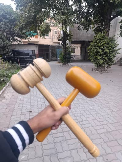 cricket bat knocking wooden hammer